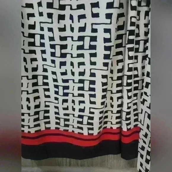 Ann Klein black and white design dress with orange strip stripe on bottom. - Picture 2 of 6